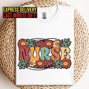 White nurse floral graphic T-shirt with colorful flowers and lettering
