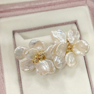 Freshwater pearl flower earrings with gold-tone bead centers