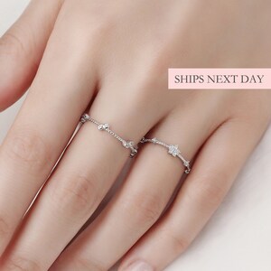 Sterling silver dainty flower diamond stackable ring on hand