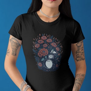 Black t-shirt with colorful floral drum graphic on the front