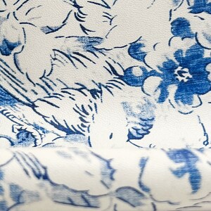 Off-white leather hide with blue floral pattern