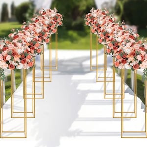 Gold metal rectangular flower stands with pink and white floral arrangements