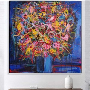 Framed abstract floral wall art painting with colorful brush strokes on blue background