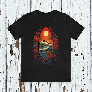 Black surfboard graphic T-shirt with red sunset, waves, and floral accents