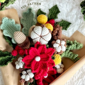Crochet flower bouquet with red, green and cream blossoms, yellow buds and white accents