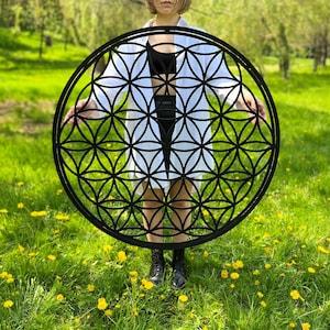 Circular wooden wall art with flower of life sacred geometry, multicolor line pattern
