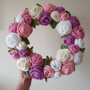 Crochet rose wreath with pink, purple, and cream crochet flowers, circular garland