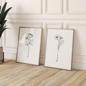 Set of two framed botanical line art prints with flower and stem designs, white frames