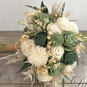 Bridal bouquet with cream rosette blooms, sage eucalyptus leaves, and dried stems