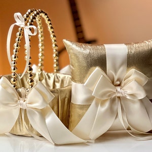 Ivory and gold wedding basket with pearl handle and ivory ring pillow with bow