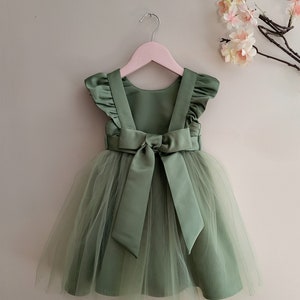 Sage green tulle flower girl dress with ruffle sleeves and back bow