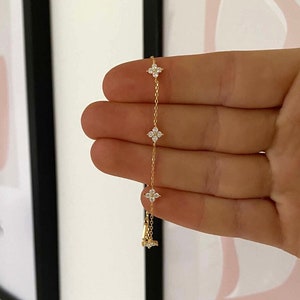 Sterling silver flower bracelet with three dangling crystal blooms on a chain