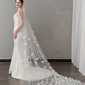 Cathedral bridal veil with scattered flower petals and long train