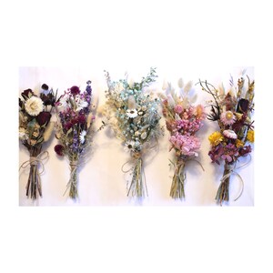 Set of dried flower bouquets with mixed blooms and twine ties, boho style