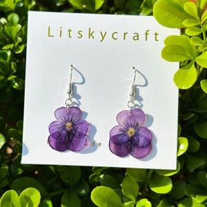 Violet resin pressed-flower dangle earrings, two purple blooms on hook backs