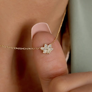 Gold-toned lotus flower pendant necklace with clear zircon-like stones, delicate chain
