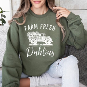Unisex dark green sweatshirt with Farm Fresh Dahlias truck graphic