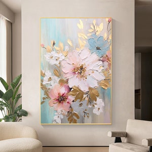 Large framed floral canvas wall art with white, pink, and blue blooms