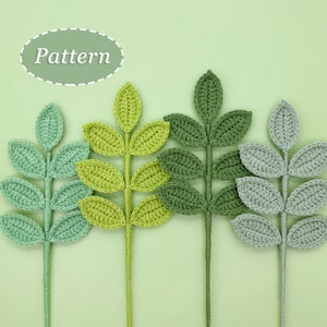 Crochet leaf and flower pattern with crocheted leaf pieces on stems