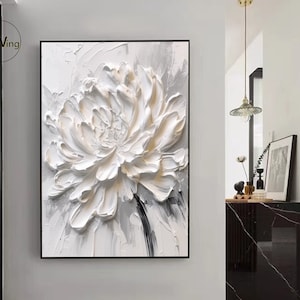 Framed 3D textured white flower painting with raised petals on light canvas