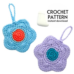 Crochet flower charm pouches, light blue and lavender, each with a circular center flower.