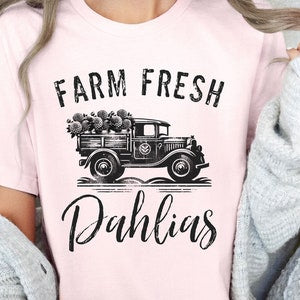 Light pink unisex short-sleeve jersey T-shirt with Farm Fresh Dahlias truck graphic
