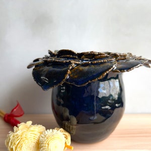 Glossy sapphire blue ceramic vase with sculpted, irregular rim detail