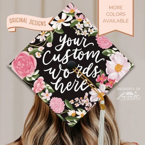 Floral graduation cap topper with pink and white blossoms and custom text