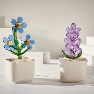 Stained glass flower potted plants with blue and purple blooms in white pots