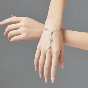 Palm cuff hand chain bracelet with dangling crystal charms and CZ stones