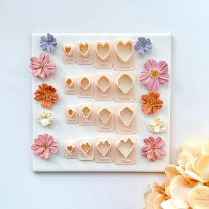 Set of four mini heart petal clay cutters with embossed outlines for polymer clay