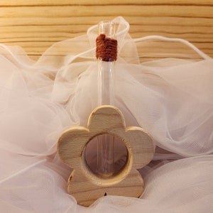 Flower-shaped soliflore vase with glass tube and raw wood base