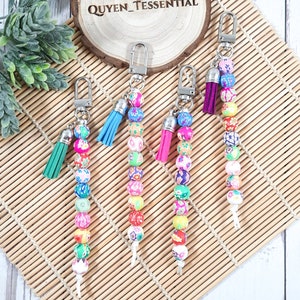 Colorful clay-bead dilation lanyard with silver badge clip and tassel