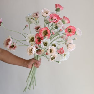 Faux poppy flower branch with pink and white blooms and green stems, bundled as a bouquet