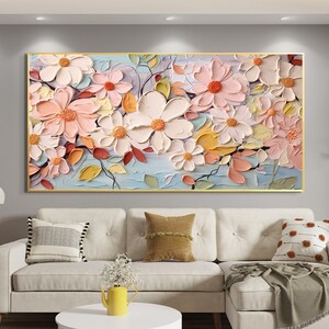 Large abstract floral oil painting on canvas with pastel pink, peach, and white flowers