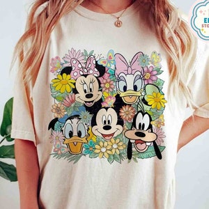 Light white T-shirt with colorful Mickey and Friends floral festival front graphic