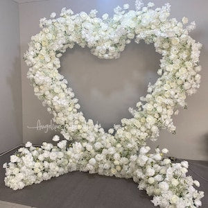 White artificial baby's breath heart floral archway decor