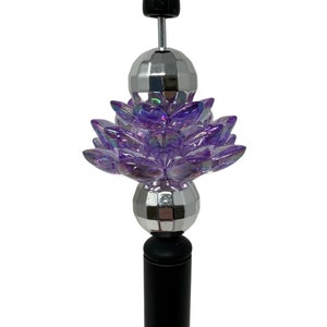 Purple acrylic lotus flower bead charm with silver spacer beads on black stem