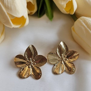 Gold flower stud earrings with textured petal details, 18K gold filled look