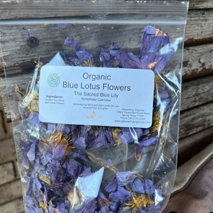Clear pouch of dried blue lotus flowers with a green and white ingredient label