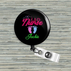 Retractable badge reel with black circular 'L&D Nurse Jackie' design and white clip