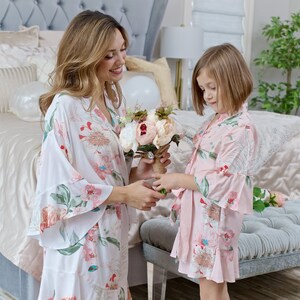 White cotton floral flower girl robe with ruffled cuffs, long sleeves and tie belt