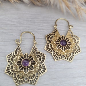 Gold-tone mandala earrings with purple amethyst-style round center and filigree petals