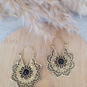 Gold mandala flower earrings with dark round stone, hoop hooks