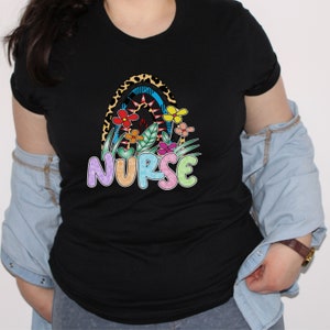 Black nurse T-shirt with colorful nurse emblem and multicolor accents