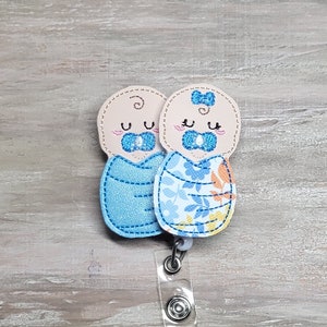 Felt swaddled baby couple keychain with blue yellow flower blankets