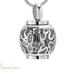 Silver cremation urn necklace pendant with floral engraving and rhinestone detail, chain
