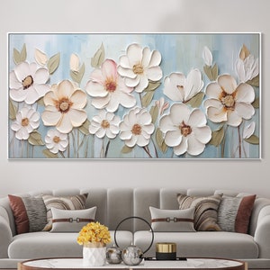 Textured floral wall art on canvas with white 3D flowers and soft pastel background