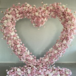 Dusty pink rose heart floral arch decoration with textured blossoms