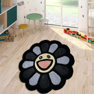 Takashi Murakami flower-face round rug with dark petals and smiling yellow face